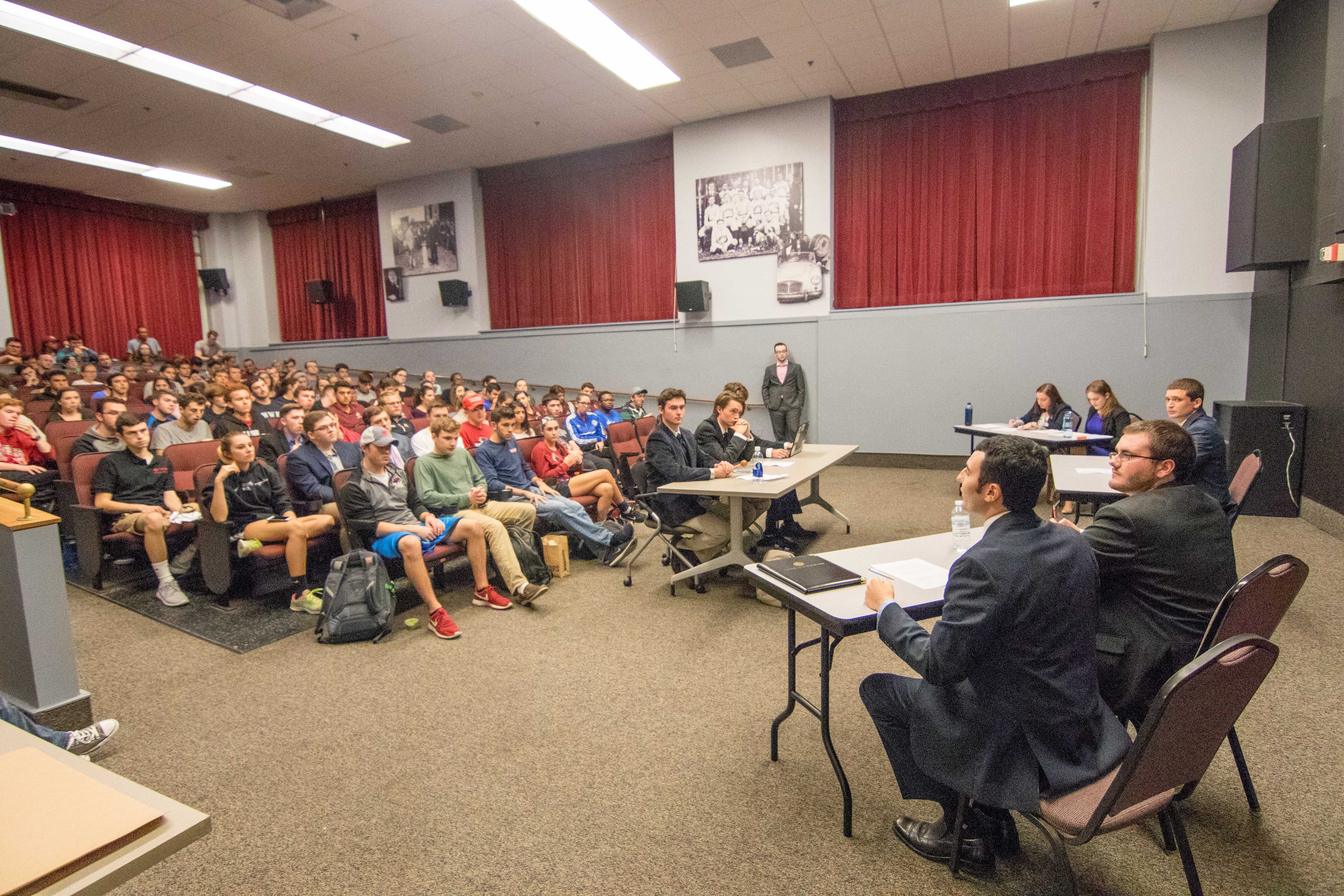 Students gather in Forum Theater on Oct. 3 for the mock debate