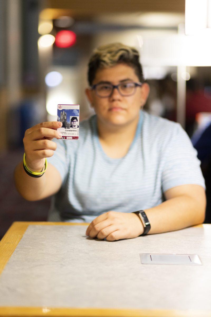 Jordon Constantino ’22 has a piece of tape on his ID to cover up his legal name which the university says he can’t change. PHOTO: Mitchell Shields 22
