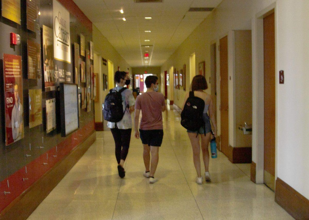 Kaleigh Cadogan ’24, Kathryn Brutzman ’24 and Joey Peracchio ’24 walk to class in Mandeville Hall on Sept. 5.
PHOTO: KELLY SHANNON ’24/THE HAWK