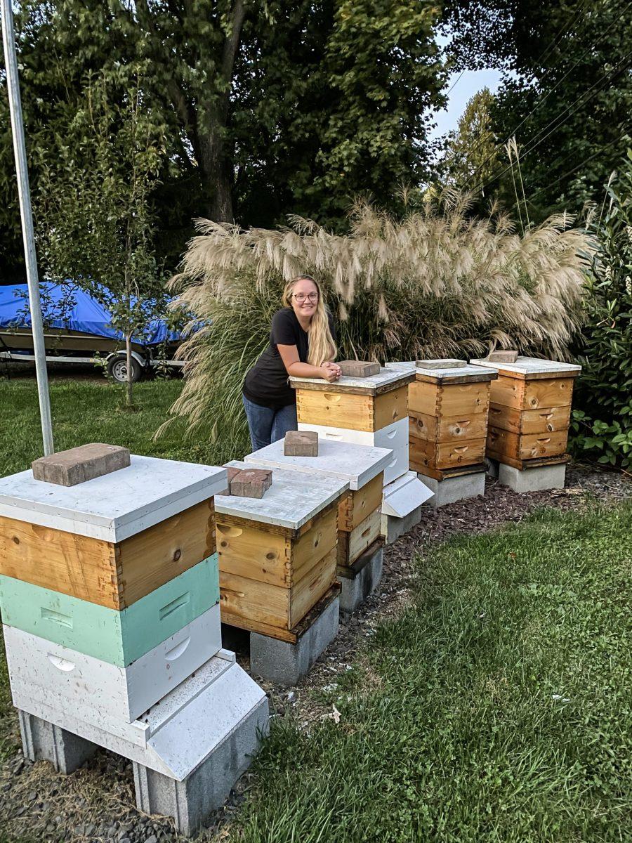 Kelly stands among her bee colonies at her Lansdale home.
PHOTO COURTESY OF MELISSA KELLY ’13 M.A.