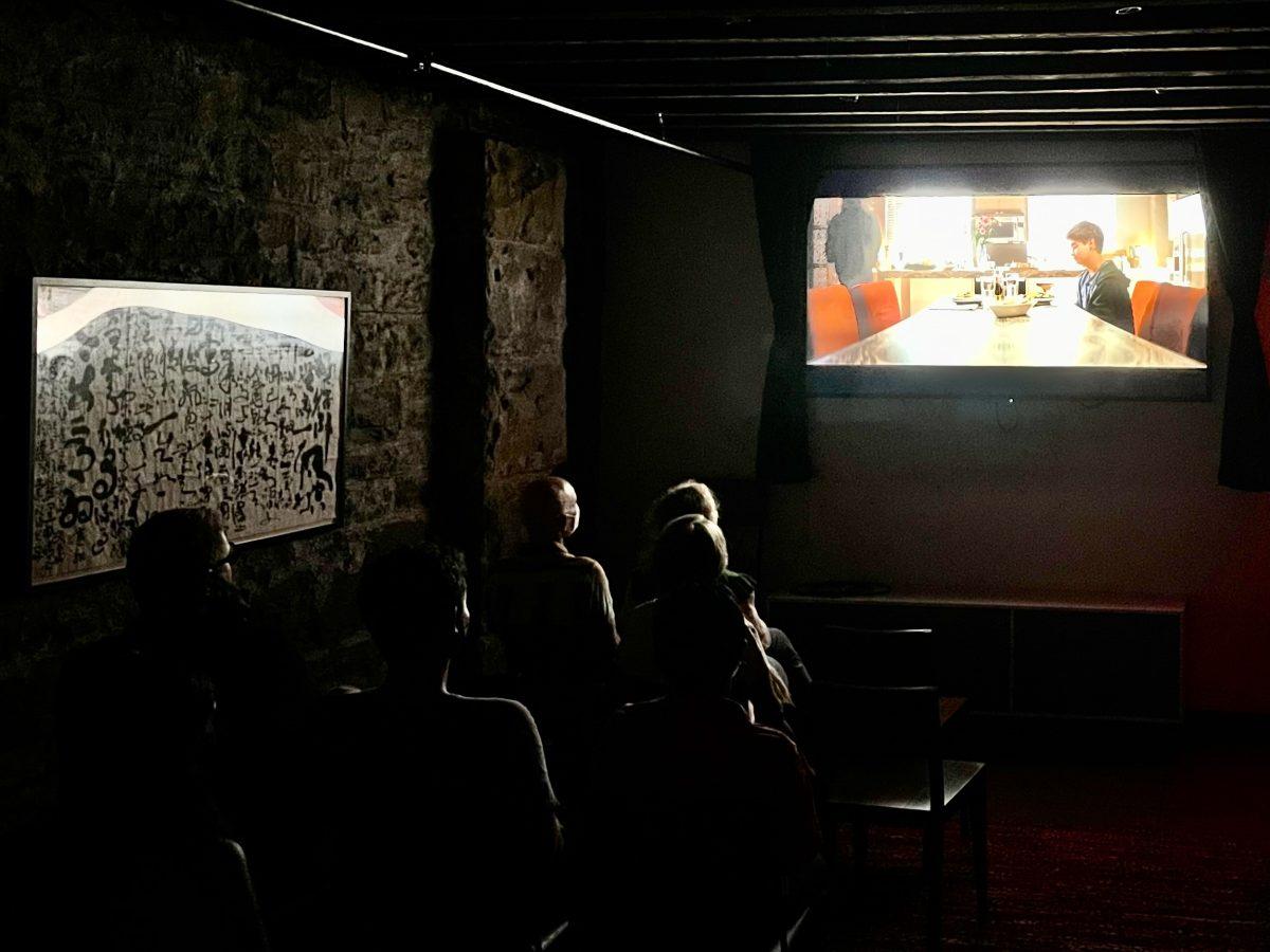 People gathered on July 27 in the basement of Pittsburghs City of Asylum to watch Venus as part of Reel Qs monthly movie series. PHOTO: ALLIE MILLER 24/THE HAWK