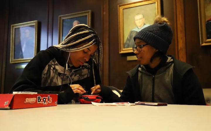 Madgee Pierre Louis ’24 and Eva Webb ’24 playing a game of Boggle at the Black Student Union Board Game Night. PHOTO: KELLY SHANNON ’23/THE HAWK
