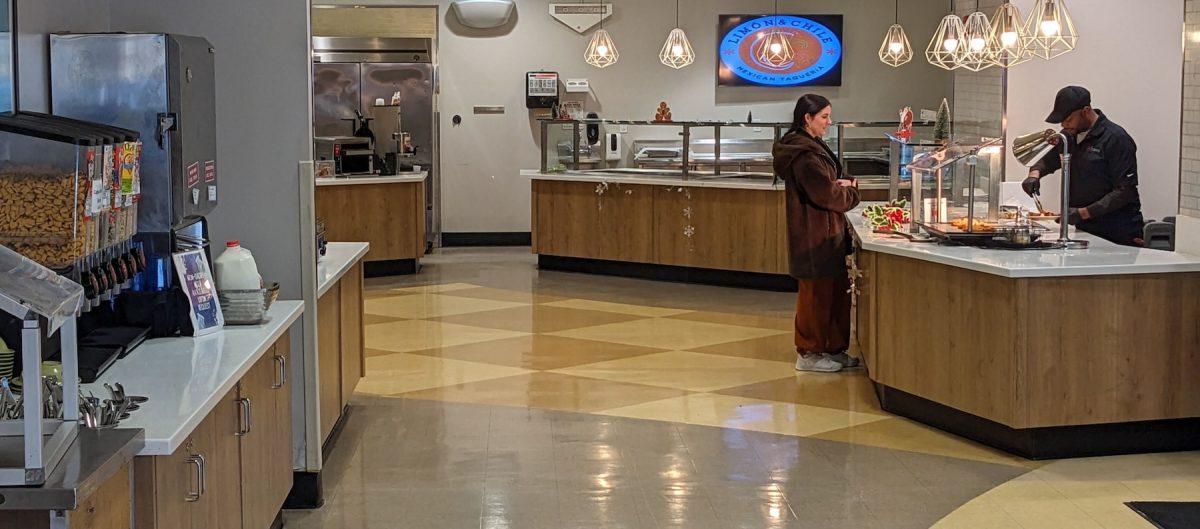 Student gets served food in Wilson Dining Hall Dec. 14, 2023. The number of students using Wilson Dining
Hall was down about 60% in the fall 2023 semester. PHOTO: THE HAWK