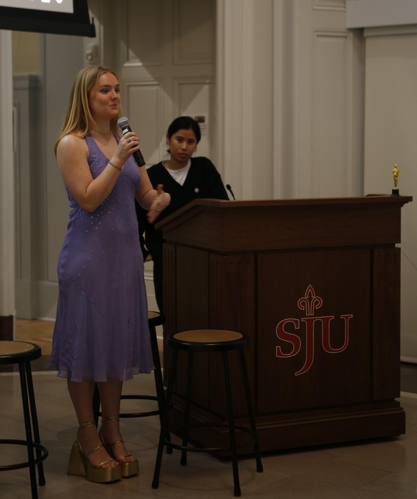 Photo of Art Club President Kelly Slater ’24 addresses audience members after film screenings