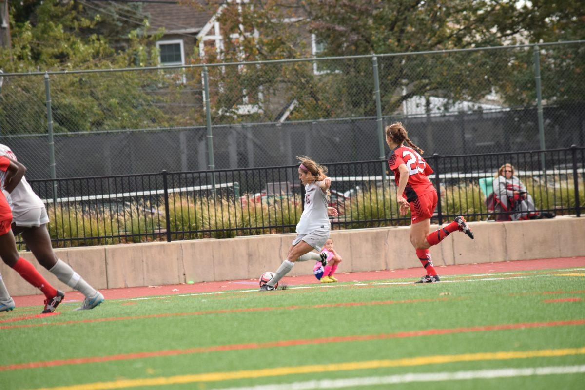 Senior Emily Gingrich takes a shot (Photo by Christy Selagy, M.A., '17).