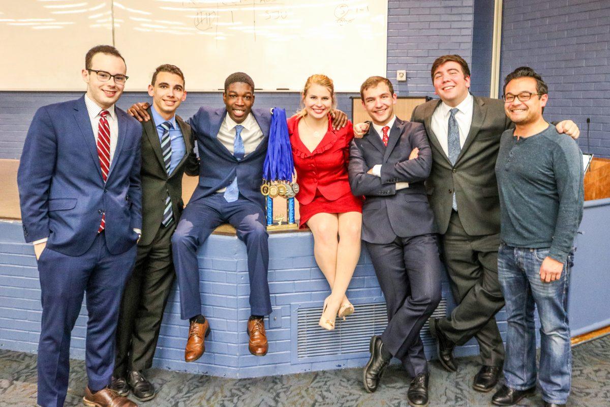 Villager Speech and Debate Team members pose with their first place trophy (Photo by Rose Weldon '19).