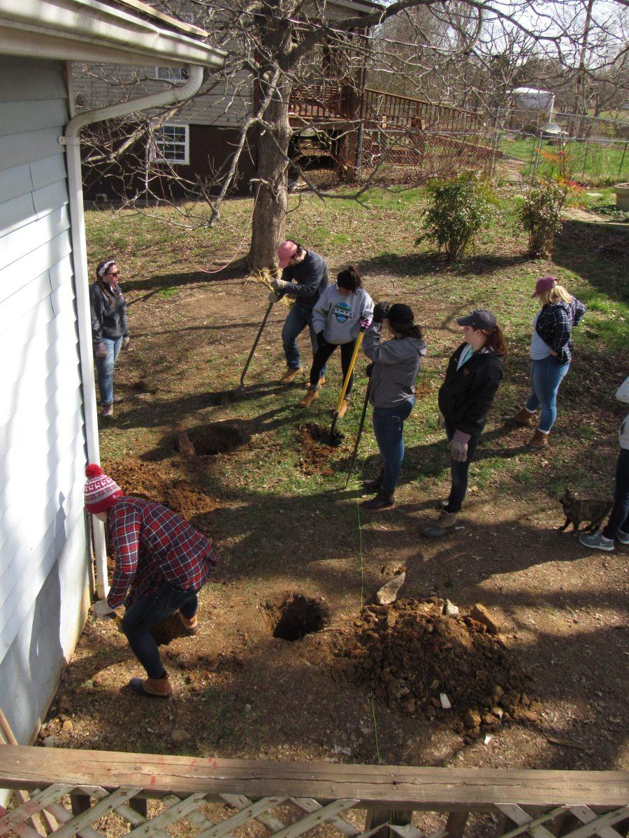 Students who went to Jonesville, VA. dig holes in preperation to put in a wheelchair ramp
(Photos by Kaitlyn Patterson 20).