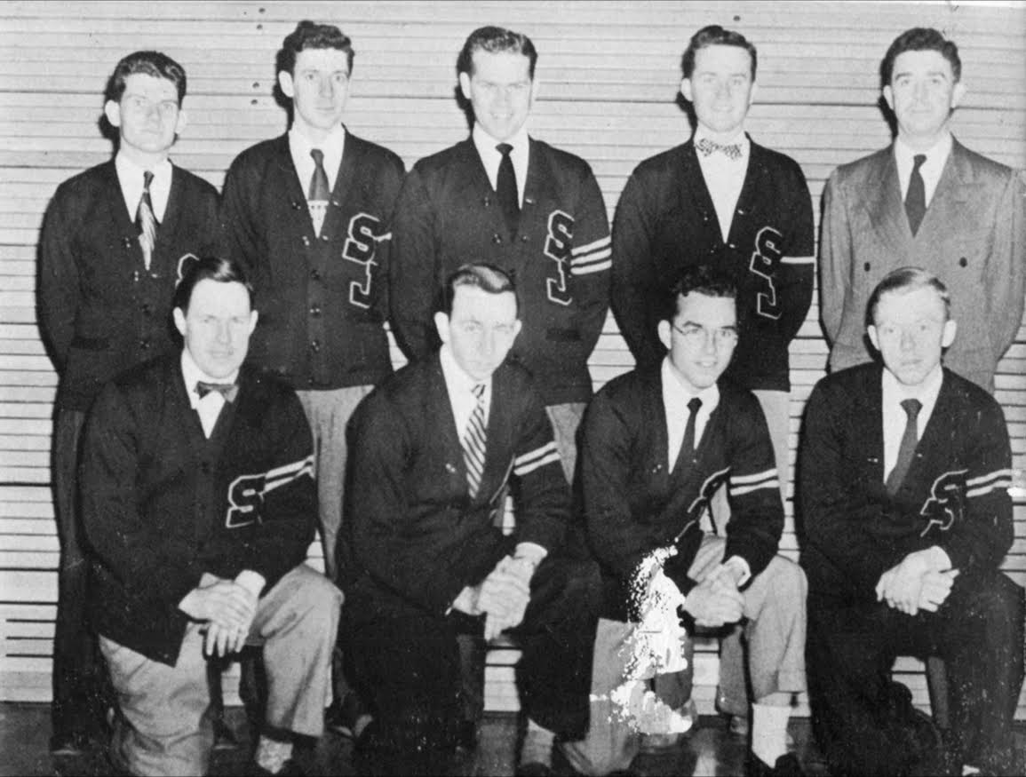 St. Joes tennis team in 1950 (Photo courtesy of Charles Reilly 50). Top row from left: Jack Hanlon, Ed Jordan,
Captain Taney Willcox, Jack Quinn, Coach Mike Boland.
 Front row, from Left: Tom Rudolph, John Bateman, Charley Reilly, Tom Phelan.