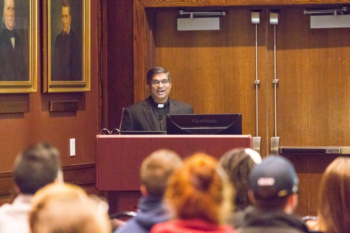 Father Seelan speaks in the President's Lounge about the significance of SQ (Photo by Luke Malanga '20).