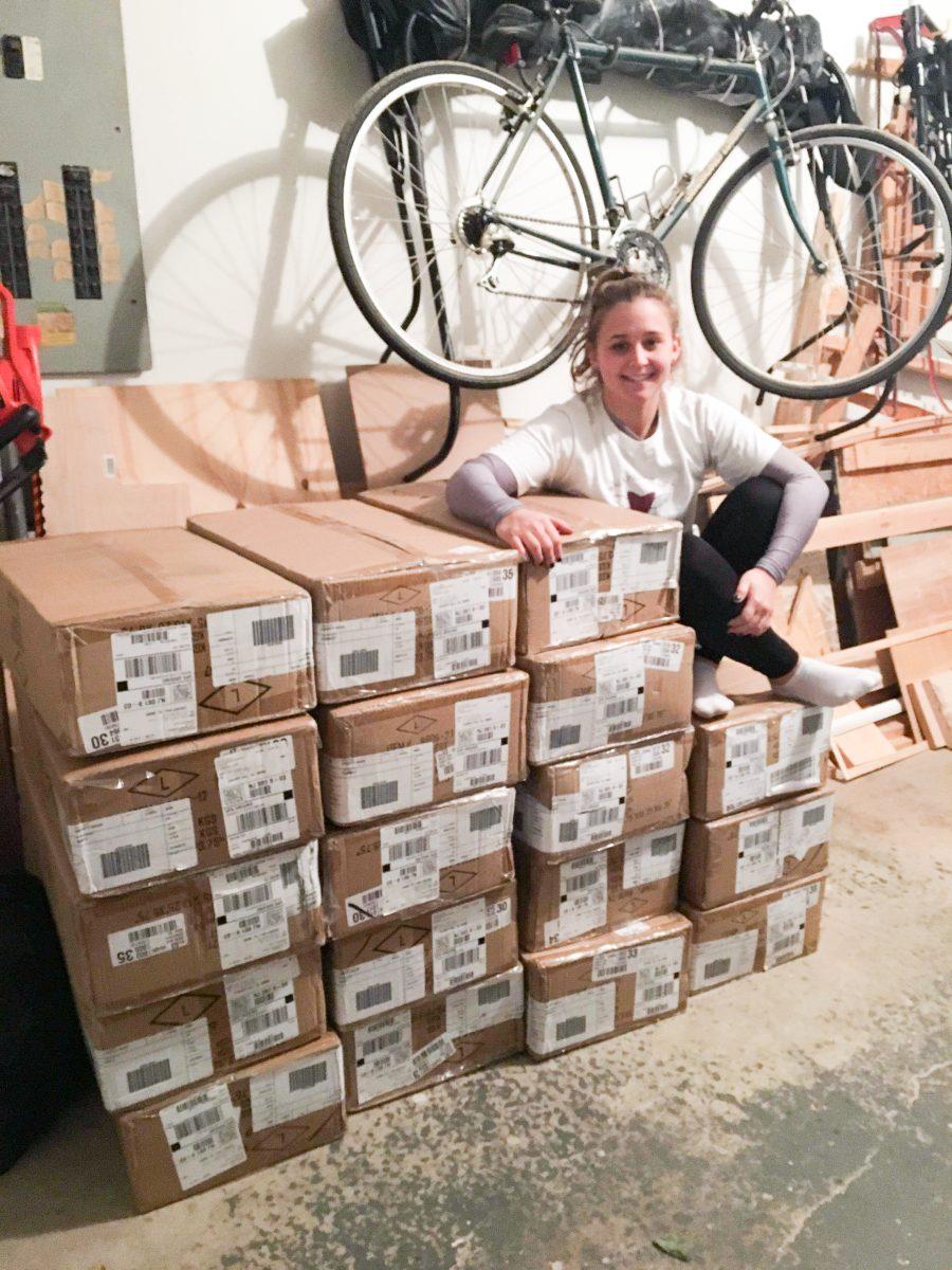 Founder Alisa Verratti 18 with boxes of donations to be sent to inter city foster care centers (Photo by Julia DiMarino 18).