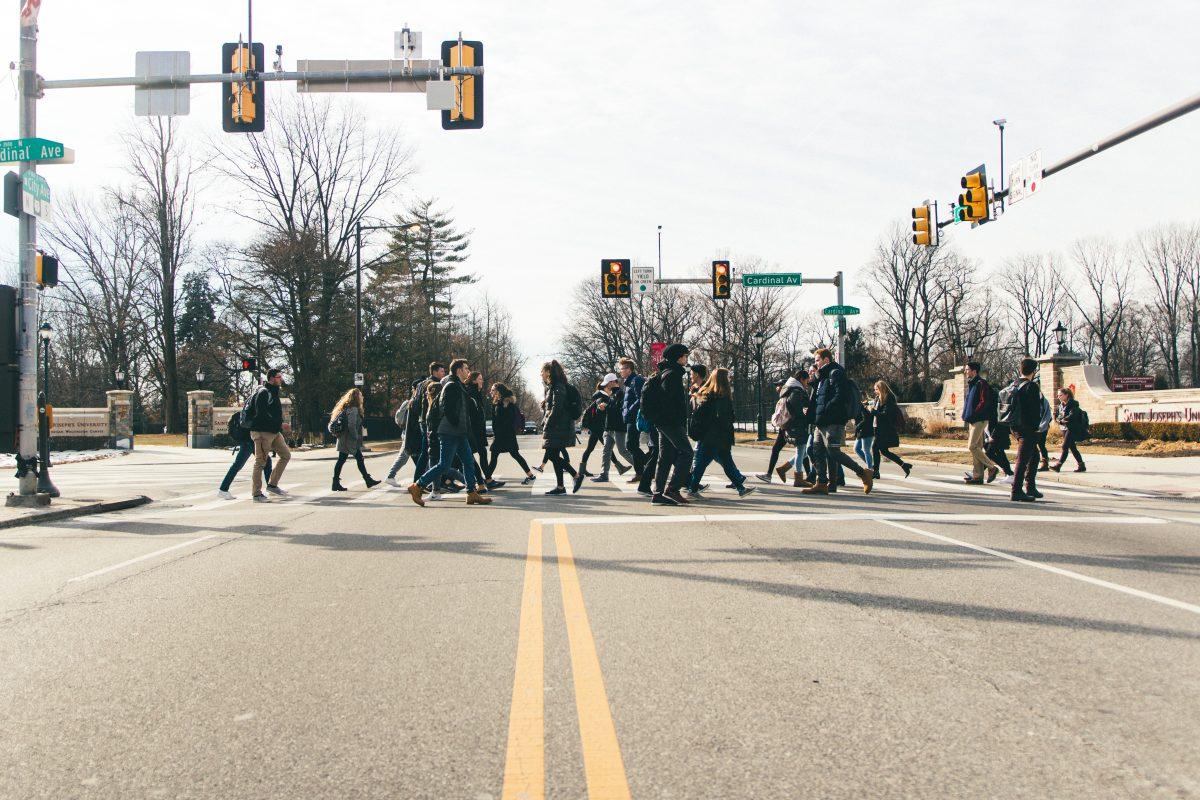 Students+walk+along+the+crosswalk+at+the+intersection+of+Cardinal+Avenue+and+City+Avenue+%28Photo+by+Matt+Barrett+%E2%80%9921%29.
