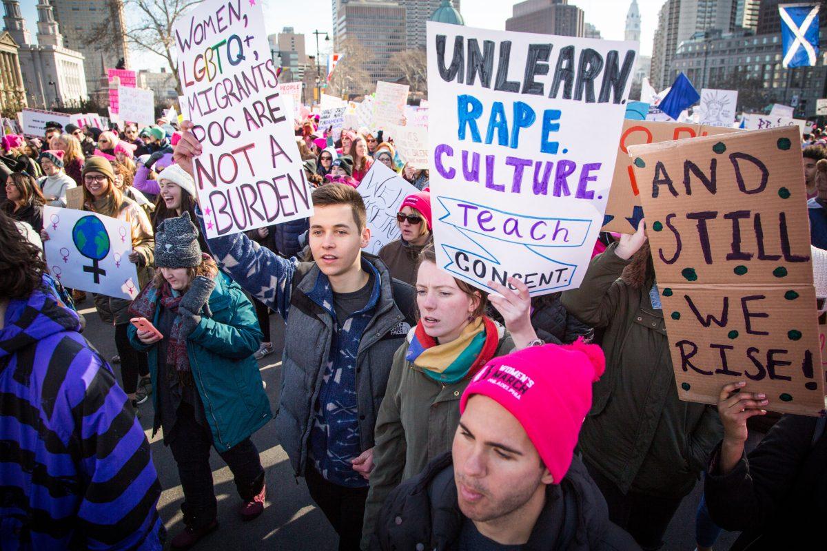 Ryan Scanlan 20, Malcolm Odum 20, Kayla Michel 20 and other St. Joes students chant at the Womens March
(Photo by Luke Malanga 20).