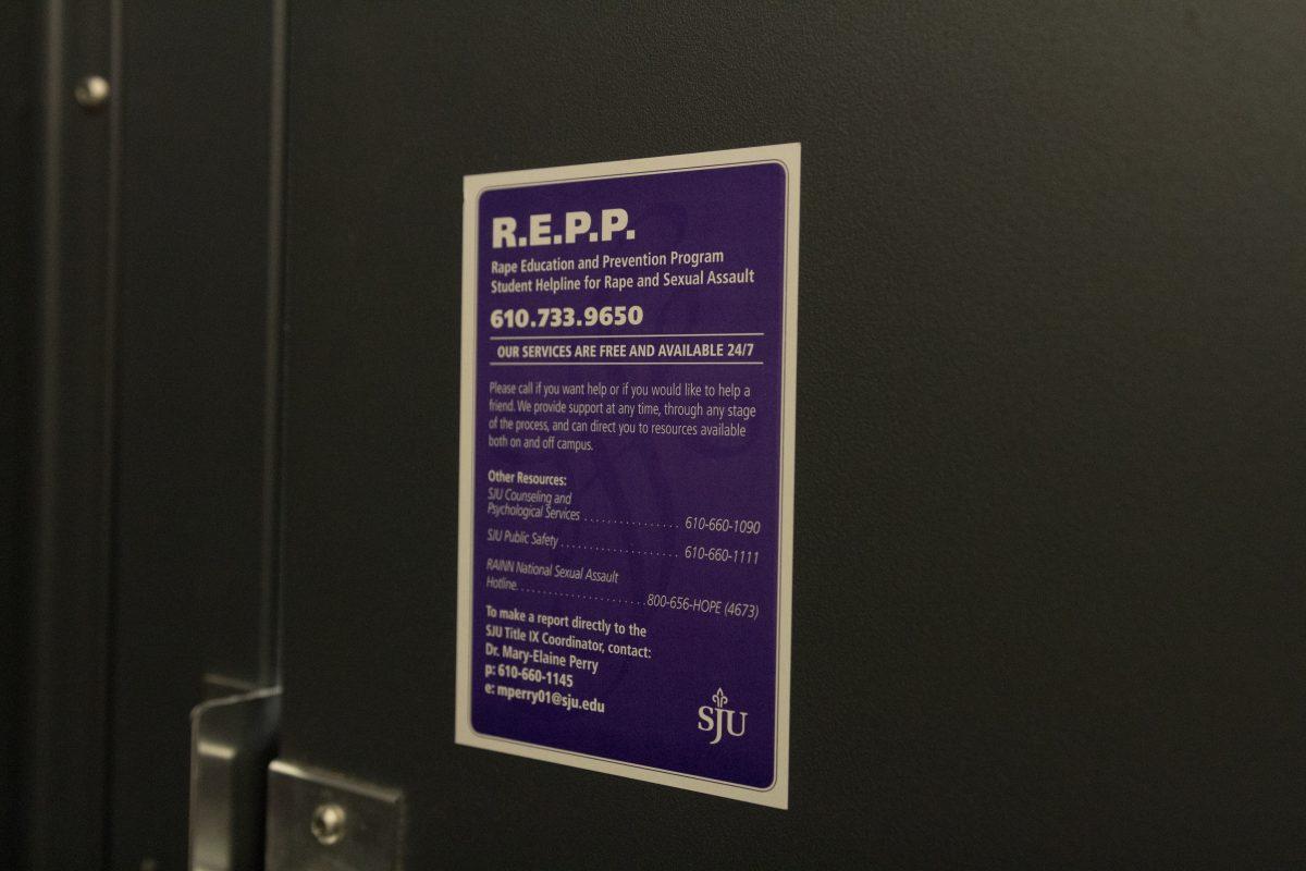 Stickers by REPP list campus resources for survivors of
sexual assault (Photo by Matt Barret '19).