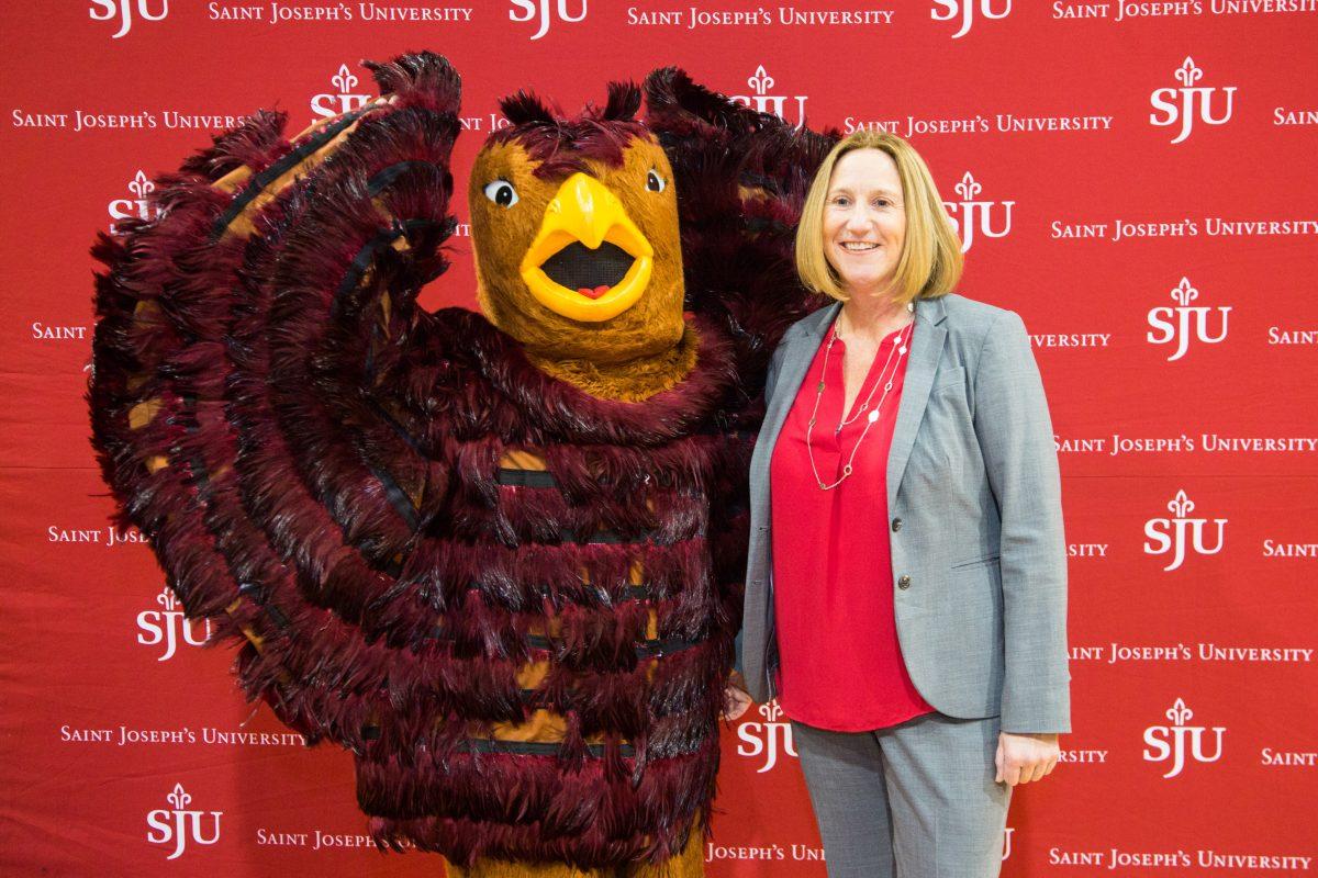 Bodensteiner poses with the Hawk mascot (Photo by Luke Malanga '20).