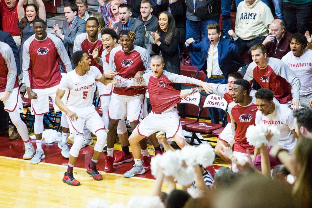 The St. Joes bench celebrates Demerys dunk (Photo by Luke Malanga 20).