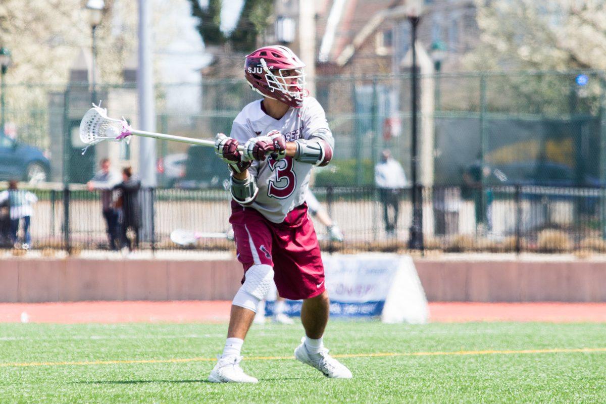 Rastivo looks to pass in a game on April 21 against Mount Saint Marys (Photo by Luke Malanga ’20).