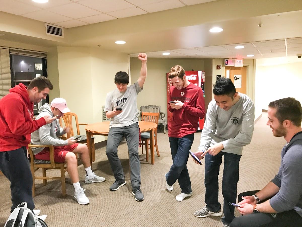 Students on the fifth floor in Lannon Hall meet in the common area to play a round of HQ Trivia (Photo by Victoria Gottlieb ‘20). 