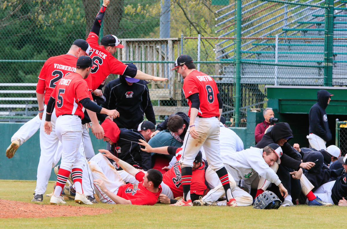 St. Joe's club baseball celebrates their victory over Temple University to win the NCBA Division II-Chesapeake Region tournament on April 29 in Purcellville, Va. (Photo by MK Photography).