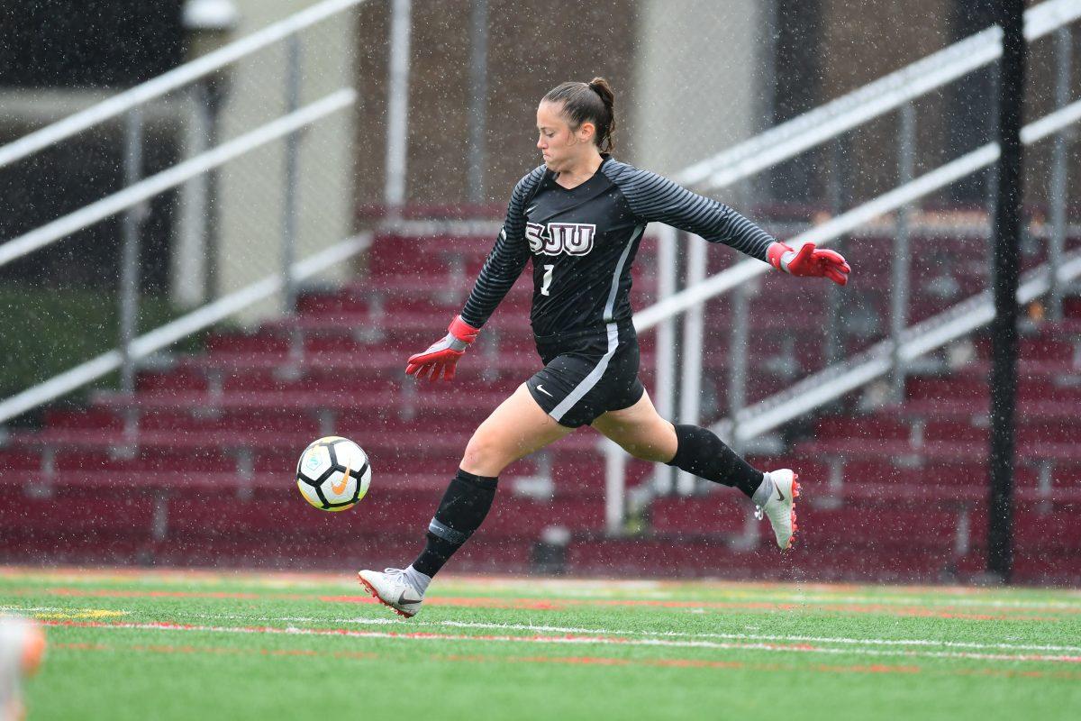 Senior Grace Bendon punts the ball downfield in a game against Bucknell (Photo courtesy of SJU Athletics).