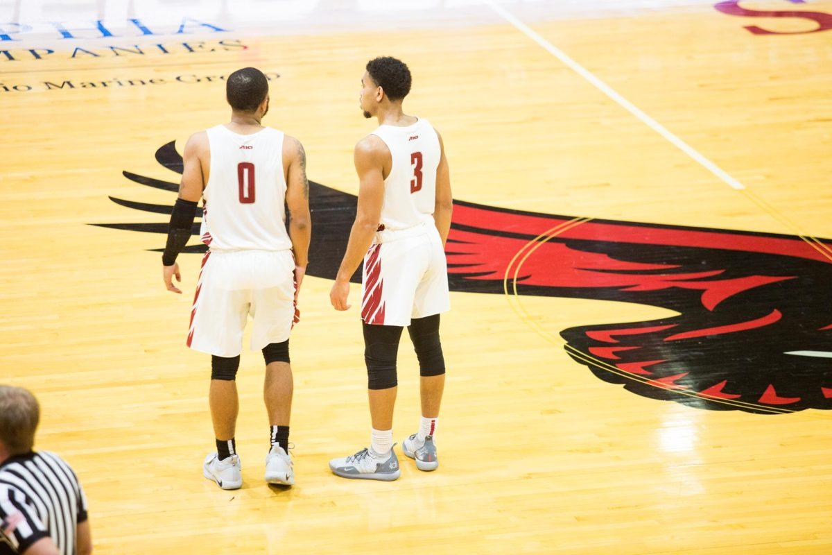 Lamarr Kimble and Jared Bynum meet in the middle of the court during a game in Hagan Arena. PHOTO: Luke Malanga 20
