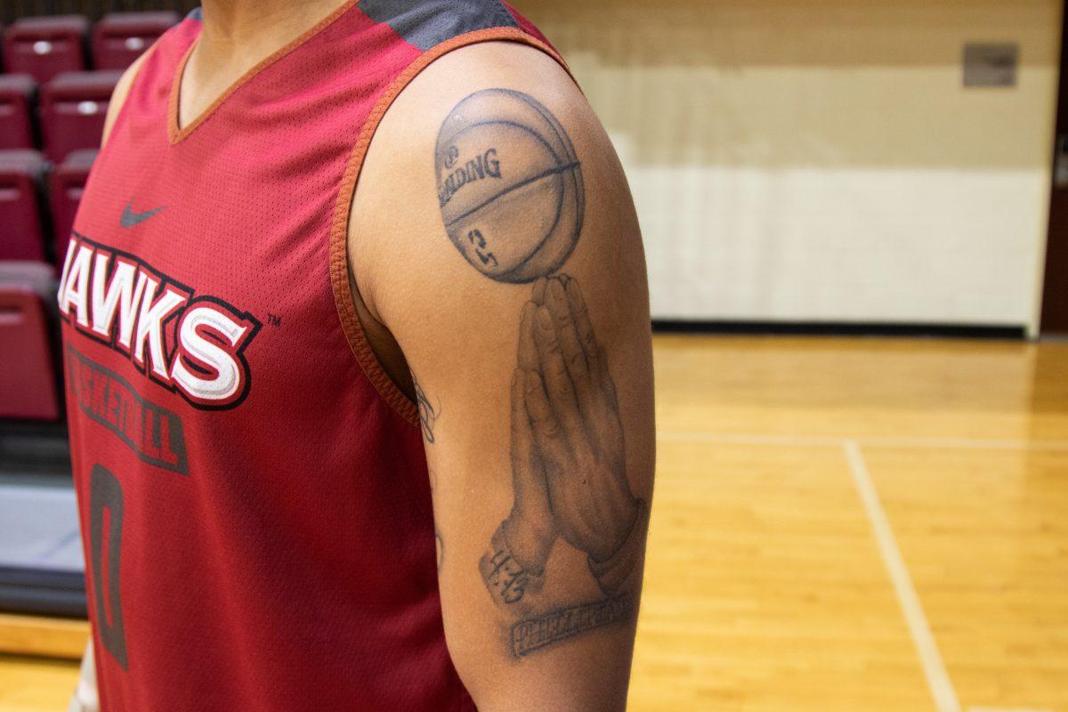 Kimbles tattoo represents faith and basketball. PHOTO: MITCHELL SHIELDS 22/THE HAWK 