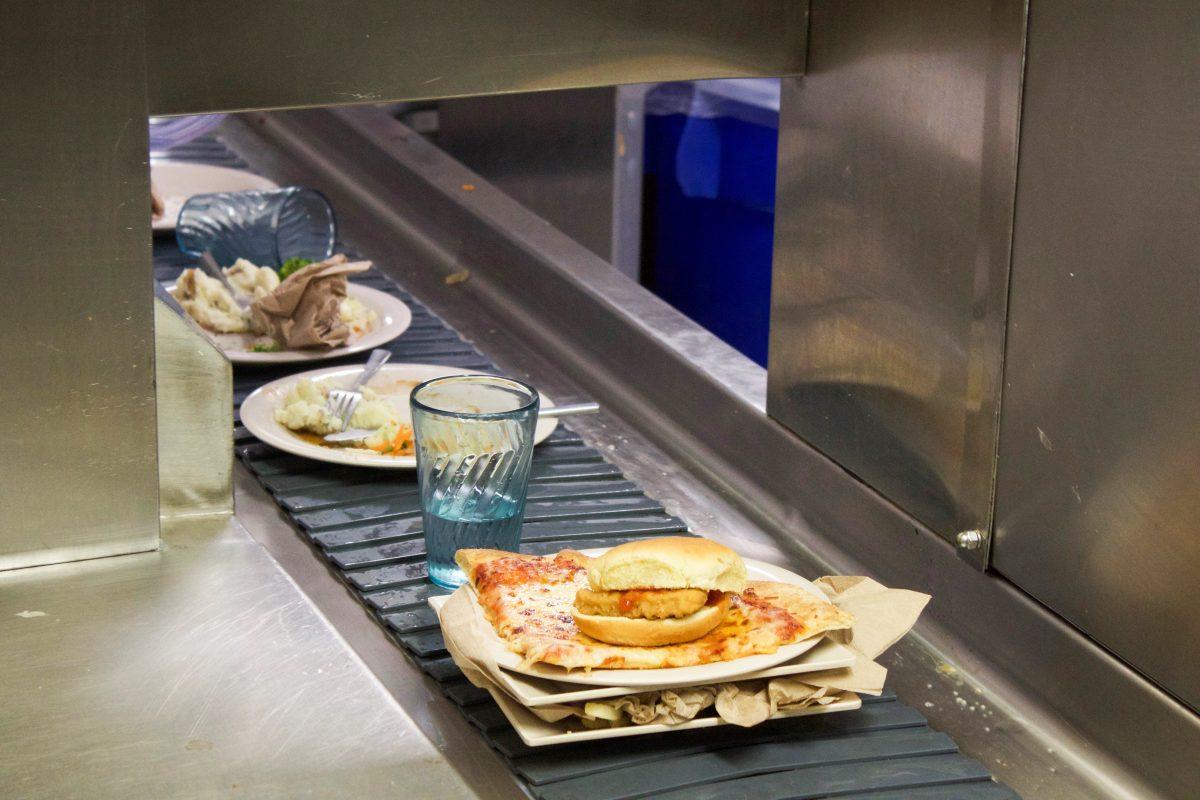 Uneaten food travels to Campion’s dishwashing area to be discarded. PHOTO: DIMETRI WILLIAMS '19/THE HAWK