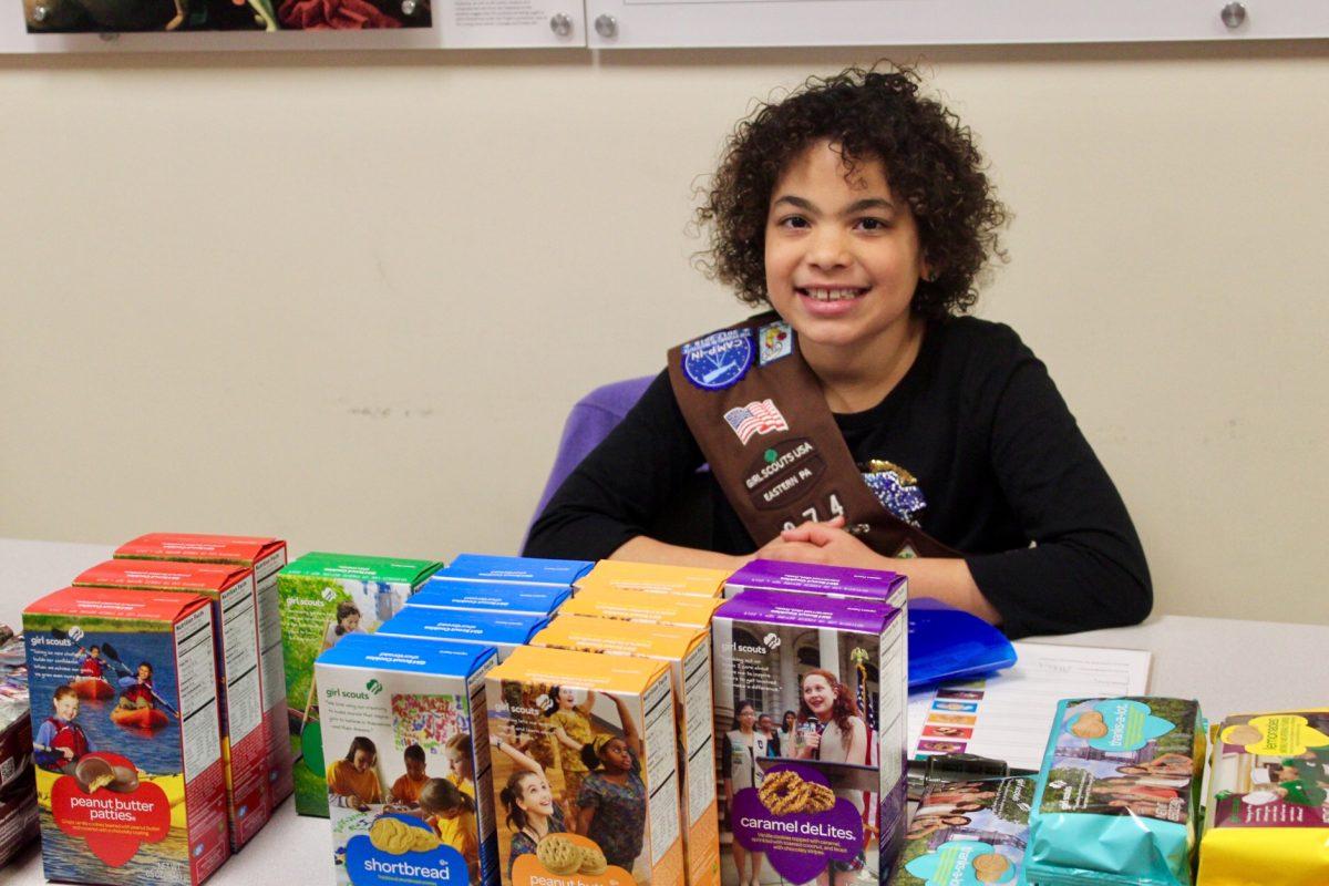 Abby Vereen selling Girl Scout cookies outside Campion Dining Hall. PHOTO: ROSE BARRETT ’20/THE HAWK