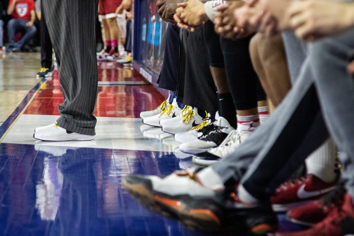 Men's basketball coaches, Phil Martelli and Geoff Arnold wear matching sneakers to spread cancer awareness. PHOTOS: MITCHELL SHIELDS ’22/THE HAWK