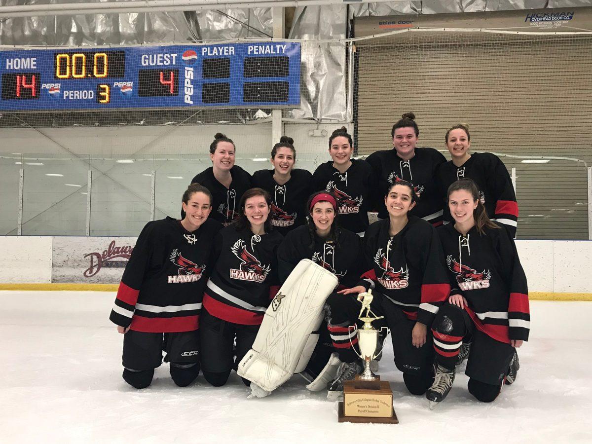The St. Joe’s women’s club ice hockey team celebrates with the trophy following their first ever Division III Delaware Valley Collegiate Hockey Conference Championship. PHOTOS COURTESY OF SJU RECREATION