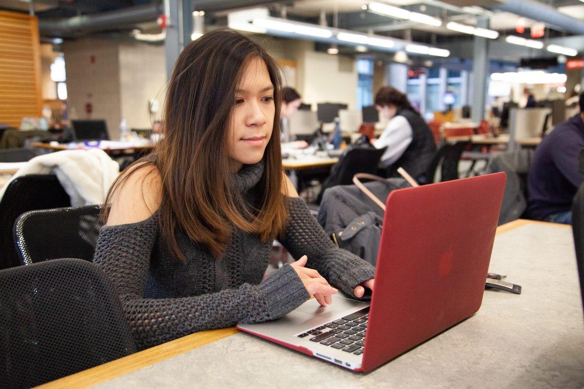 Fulbright semifinalist Angela Nguyen ’19 in the library. PHOTOS: MITCHELL SHIELDS ’22/THE HAWK
