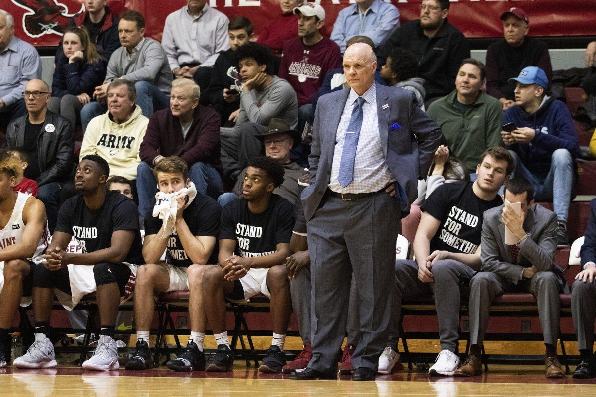 Martelli+stands+on+the+sidelines+during+his+last+game+at+Michael+J.+Hagan+85+Arena+against+the+University+of+Rhode+Island+on+March+5%2C+2019.+PHOTO%3A+MITCHELL+SHIELDS+%E2%80%9922+%2FTHE+HAWK