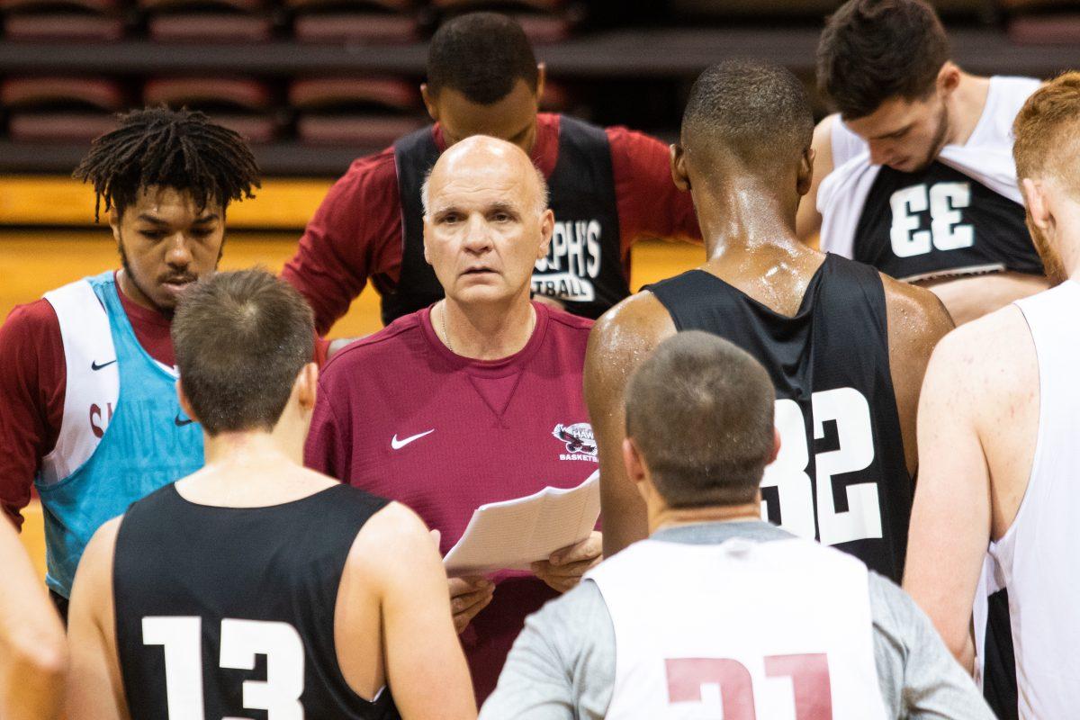 Martelli speaks to his players during the first practice of the 2017-2018 season. PHOTO: LUKE MALANGA ’20/THE HAWK