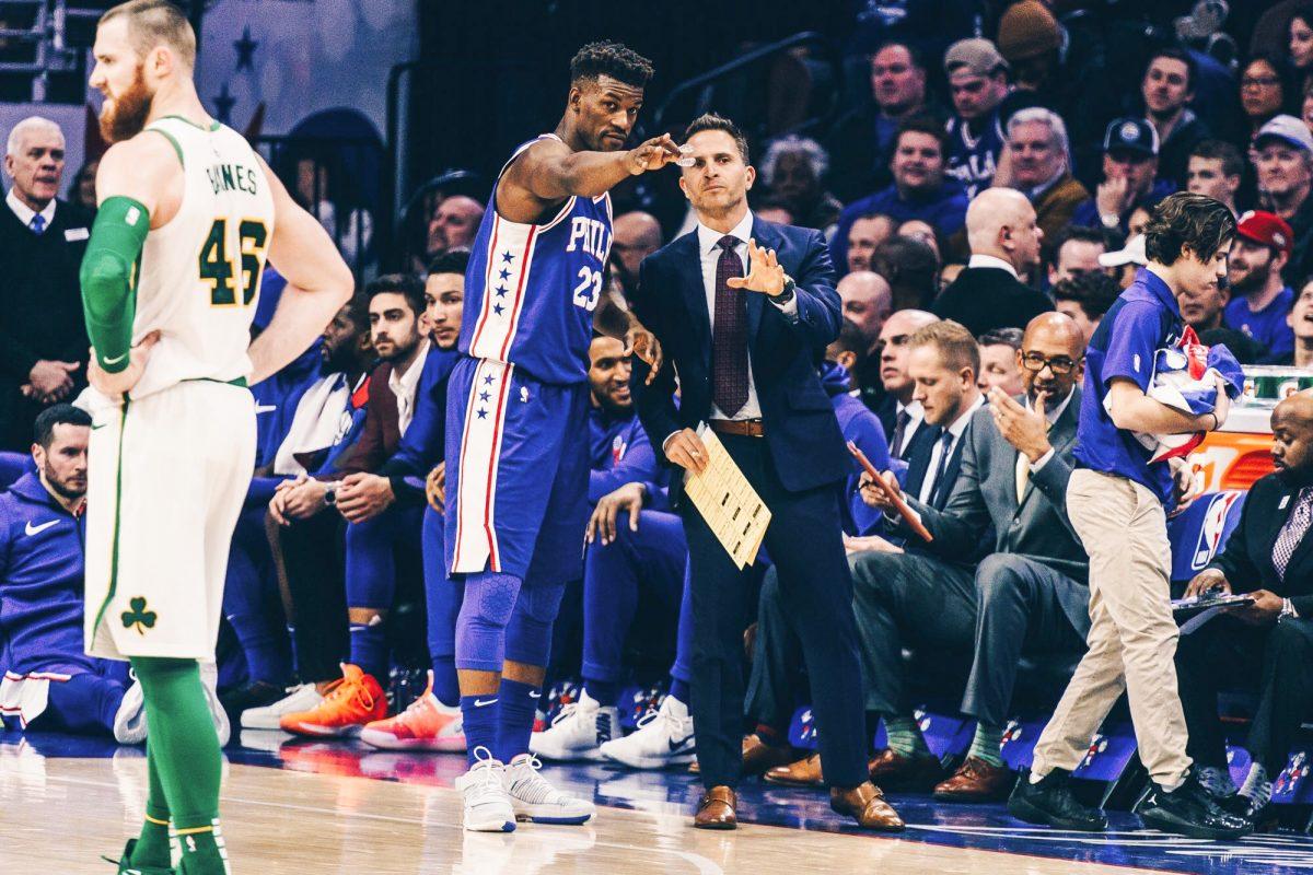 Billy Lange confers with Jimmy Butler on the Philadelphia 76ers' sideline during his time as an assistant coach. PHOTO COURTESY OF PHILADELPHIA 76ERS