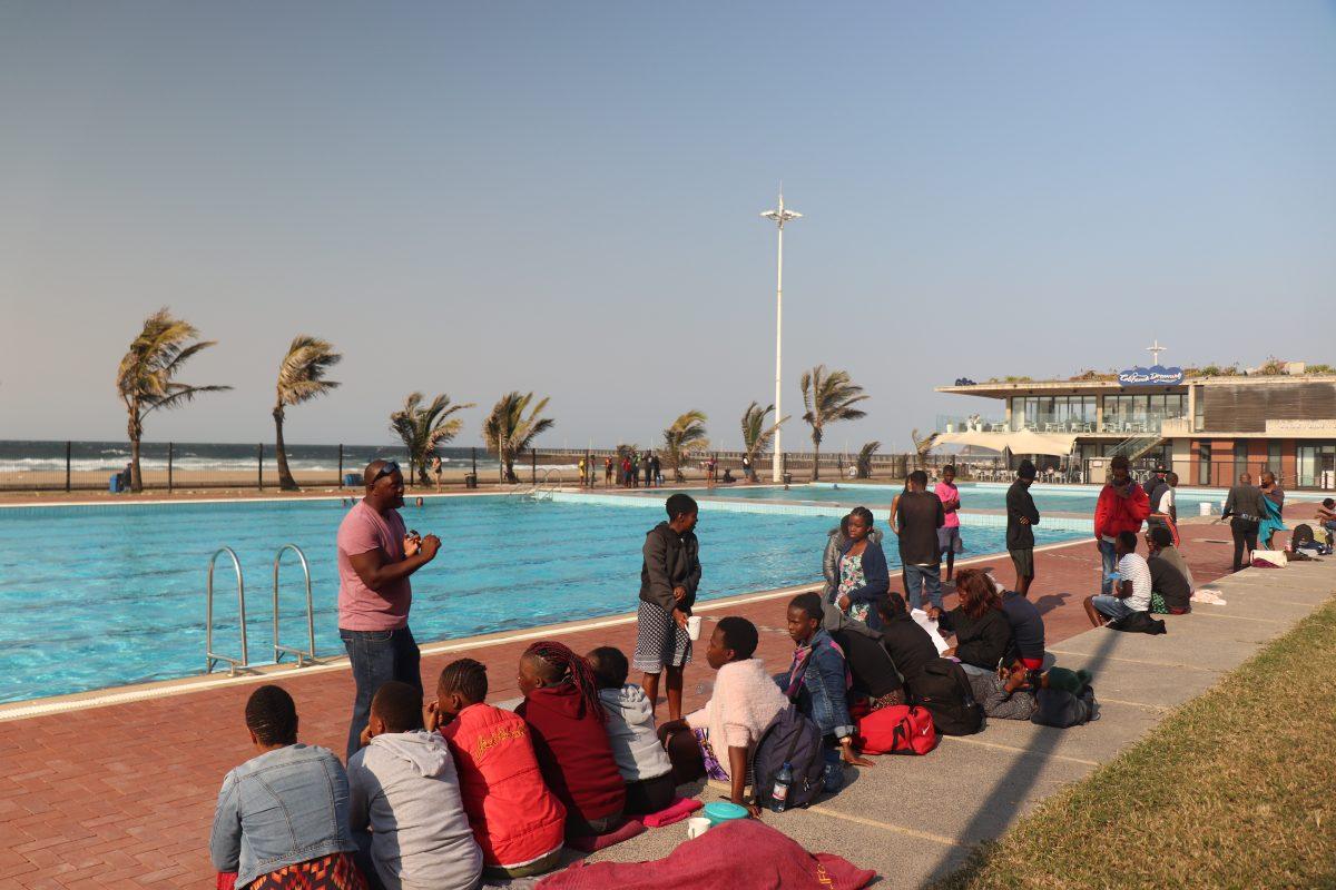 Xolani Jobe, senior lifeguard, speaks to new recruits at the Rachel Finlayson Swimming Pool on the Duran beachfront. Lifesaving South Africa, which will employ the trainees once they are certified, has made 126,492 rescues to date. PHOTO: Alex Hargrave 20