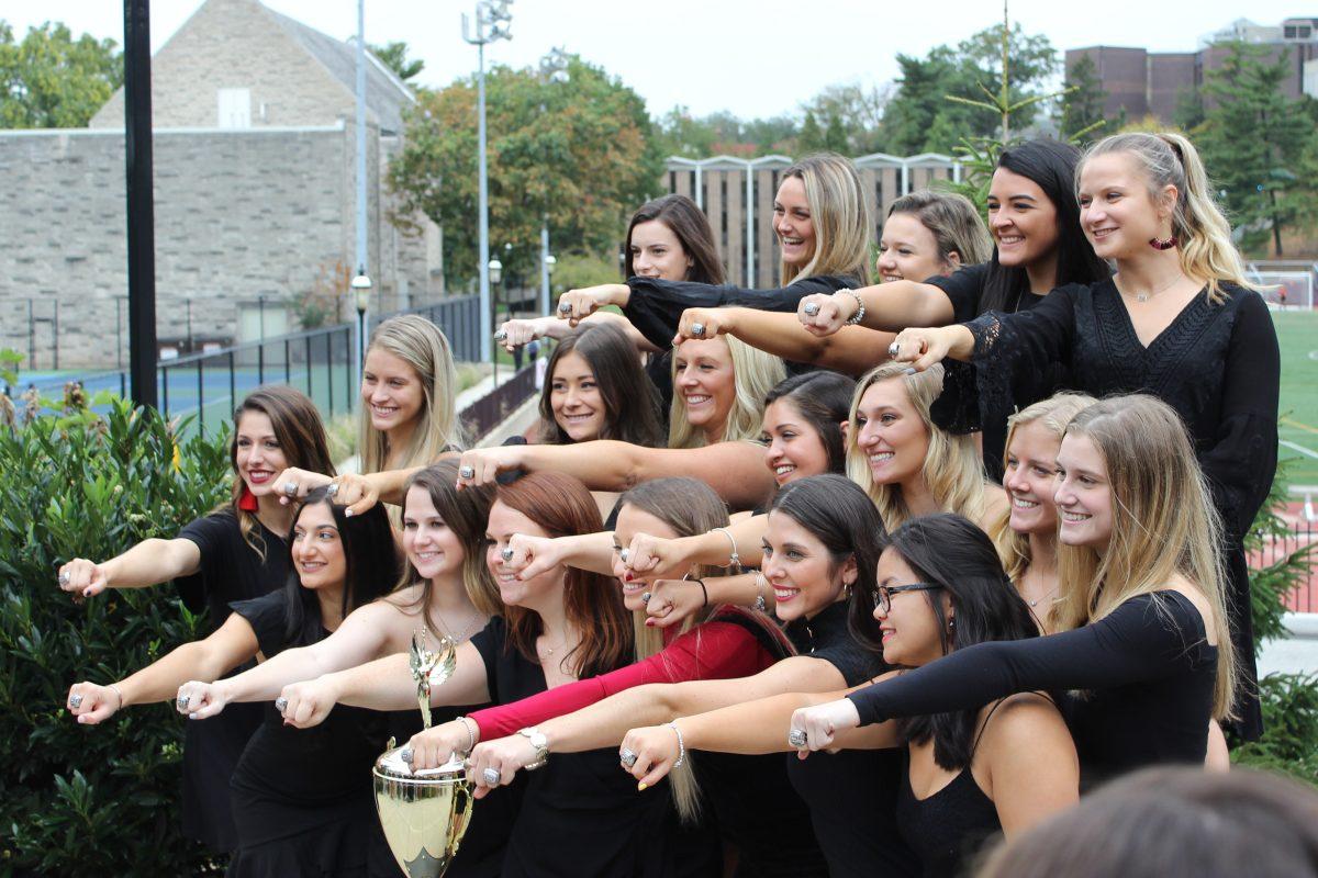 Members of the 2018-2019 cheer team show off their rings. PHOTO COURTESY OF: Katie Teeling ’15