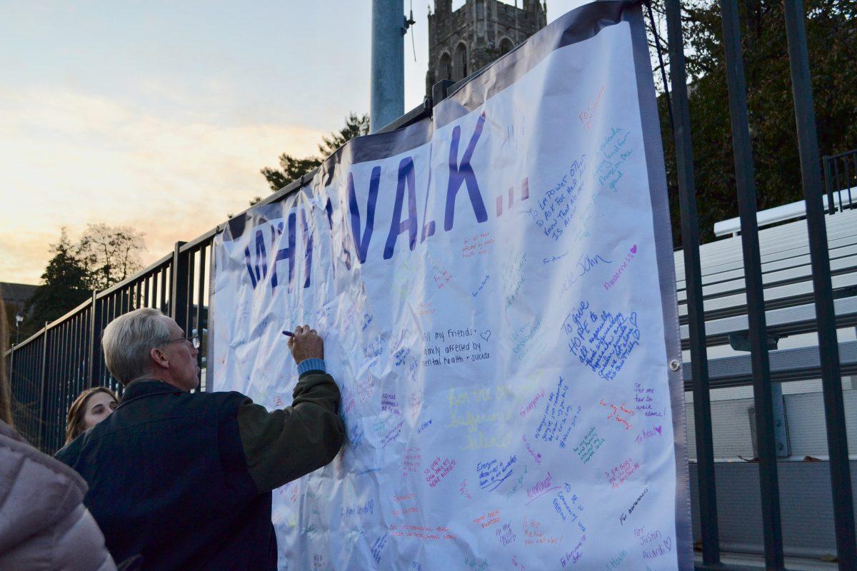 Attendees express why they choose to participate in the Out of the Darkness walk. PHOTOS: LESLIE QUAN ’22/THE HAWK