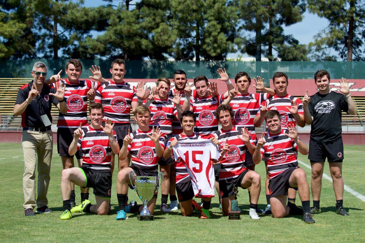 Daniel “Shaggs” Yarusso (far left) celebrates with the St. Joe’s rugby team after winning the Jesuit Cup in 2018. PHOTO COURTESY OF SJU RUGBY