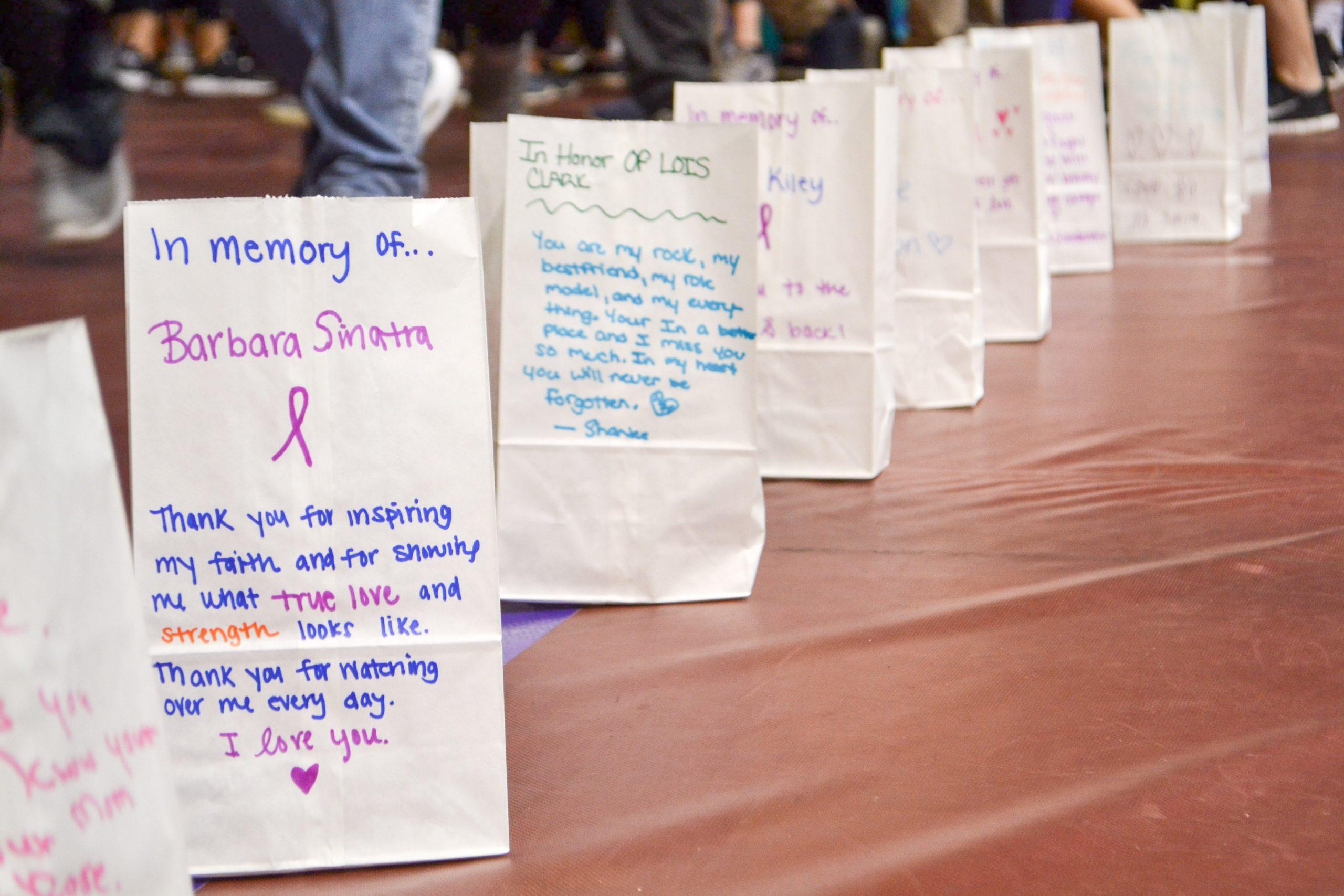Luminaria bags line the Michael J. Hagan Arena floor to commerate those affected by cancer during the 2017 Relay for Life event. PHOTO: KRISTEN BABICH 20/THE HAWK
