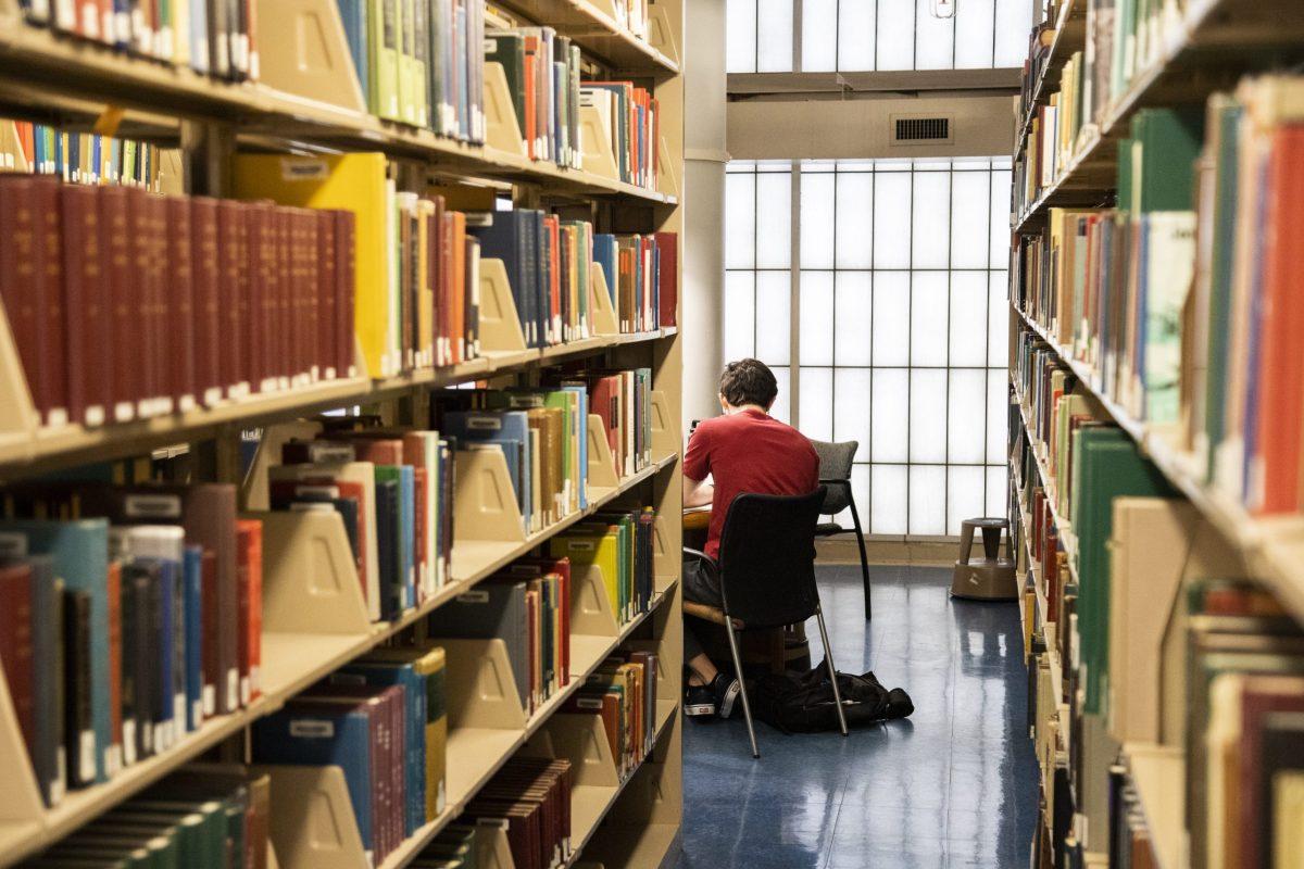 A student studies in the Francis A. Drexel Library. PHOTO: MITCHELL SHIELDS '22/THE HAWK