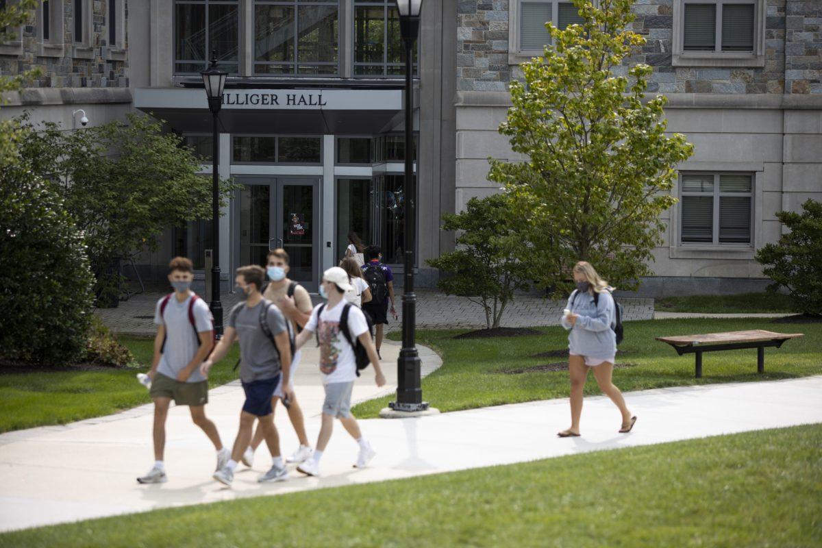 A group of students walk past Villiger Hall, where clusters of the virus appeared.
PHOTO: MITCHELL SHIELDS ’22/THE HAWK