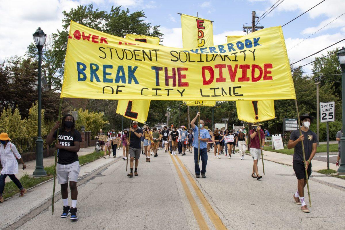 Students and supporters lead the march with signs down Bala Avenue in Lower Merion Township with other protesters close behind. PHOTOS: DANNY REMISHEVSKY 23/THE HAWK