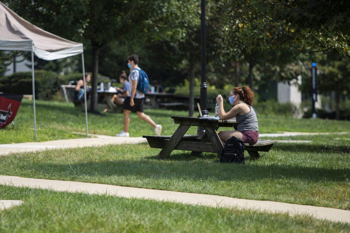 Students use outdoor spaces to study and attend online courses. PHOTO: MITCHELL SHIELDS 22/THE HAWK