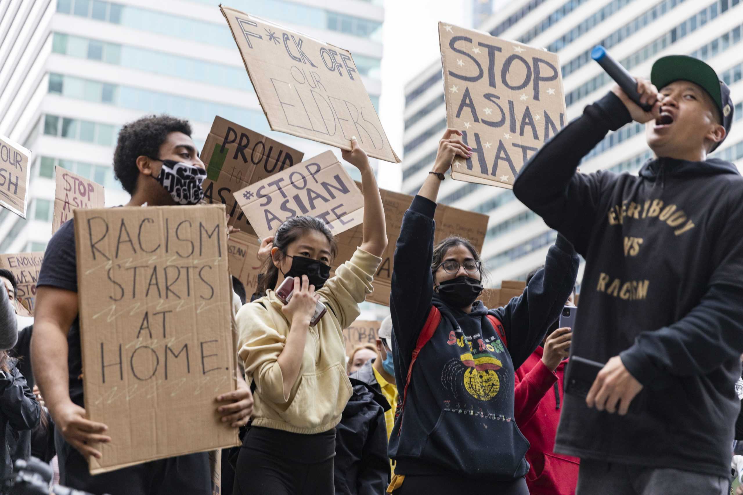 William Lex Ham (far right) chants with marchers in Dilworth Park after marching from Chinatown. PHOTO: MITCHELL SHIELDS ’22/THE HAWK