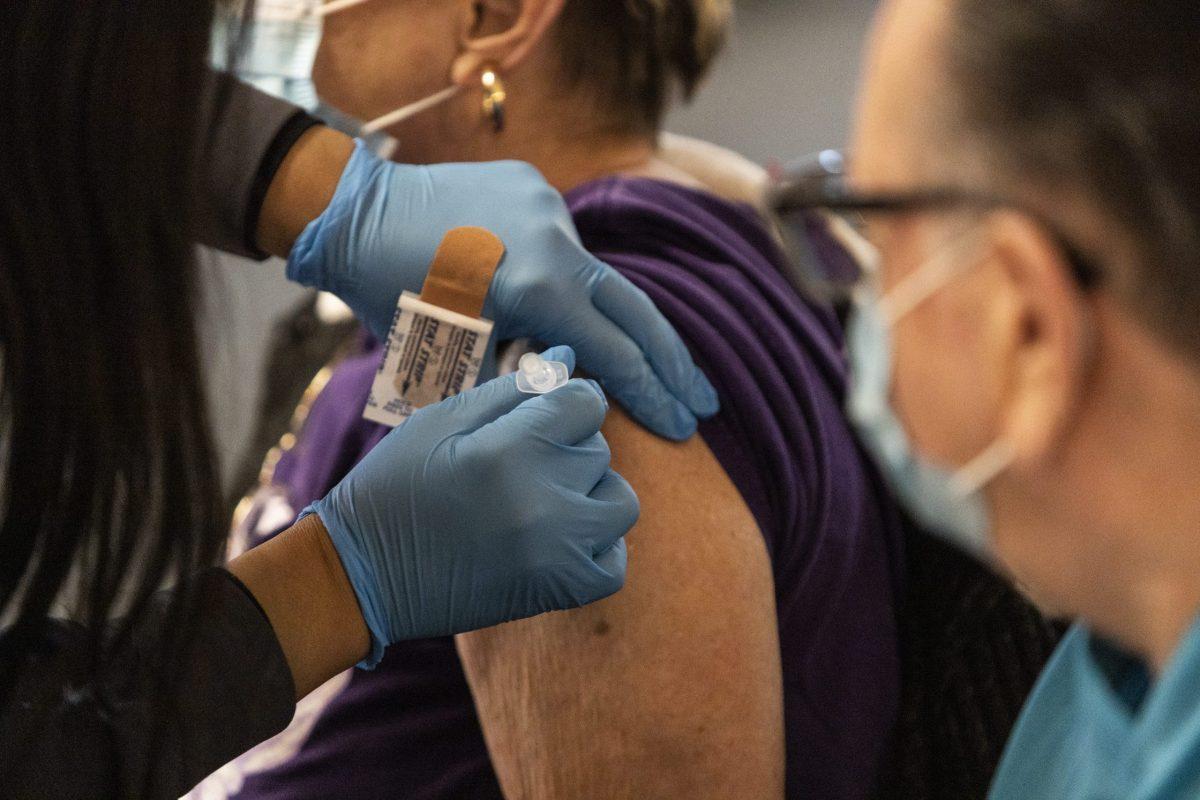 A woman receives the Pfizer COVID-19 vaccine on the opening day of the city’s sixth vaccination site at Edward O’Malley Athletic Association in South Philadelphia on March 22.
PHOTO: MITCHELL SHIELDS ’22/THE HAWK