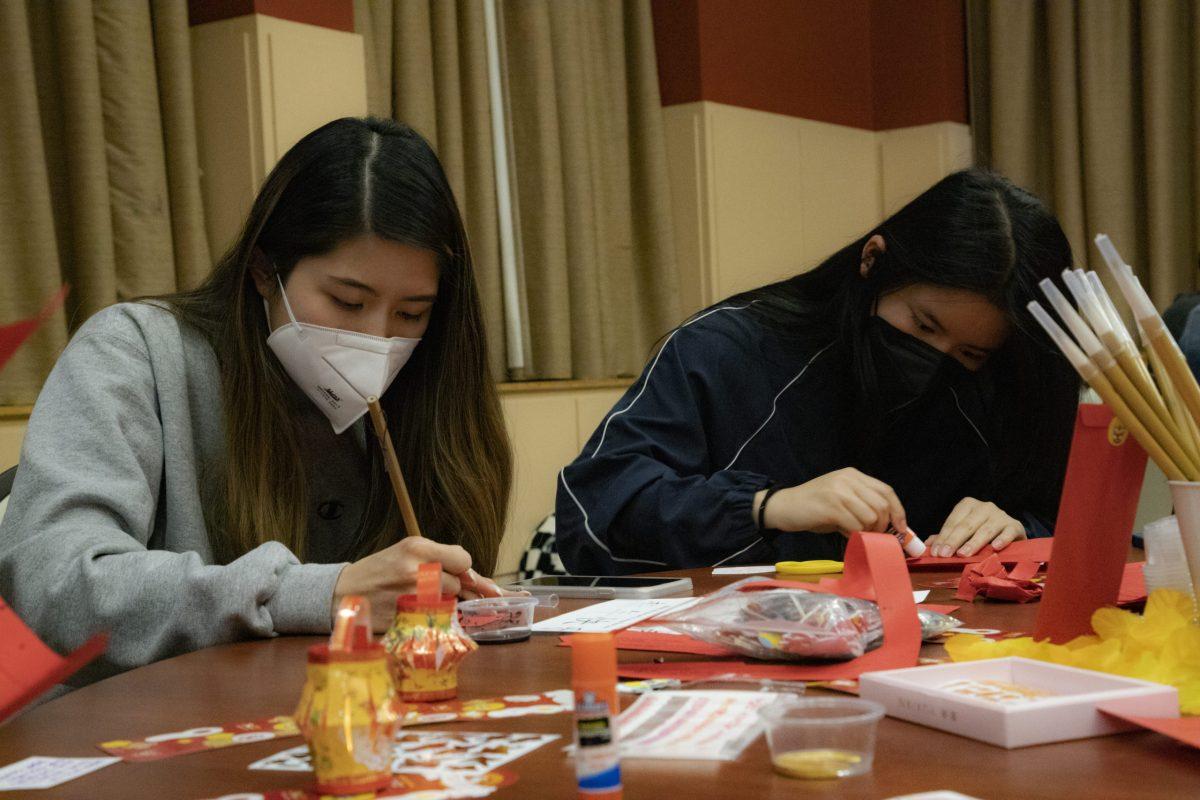 Students paint mini lanterns as part of the Lunar New Year festivities.