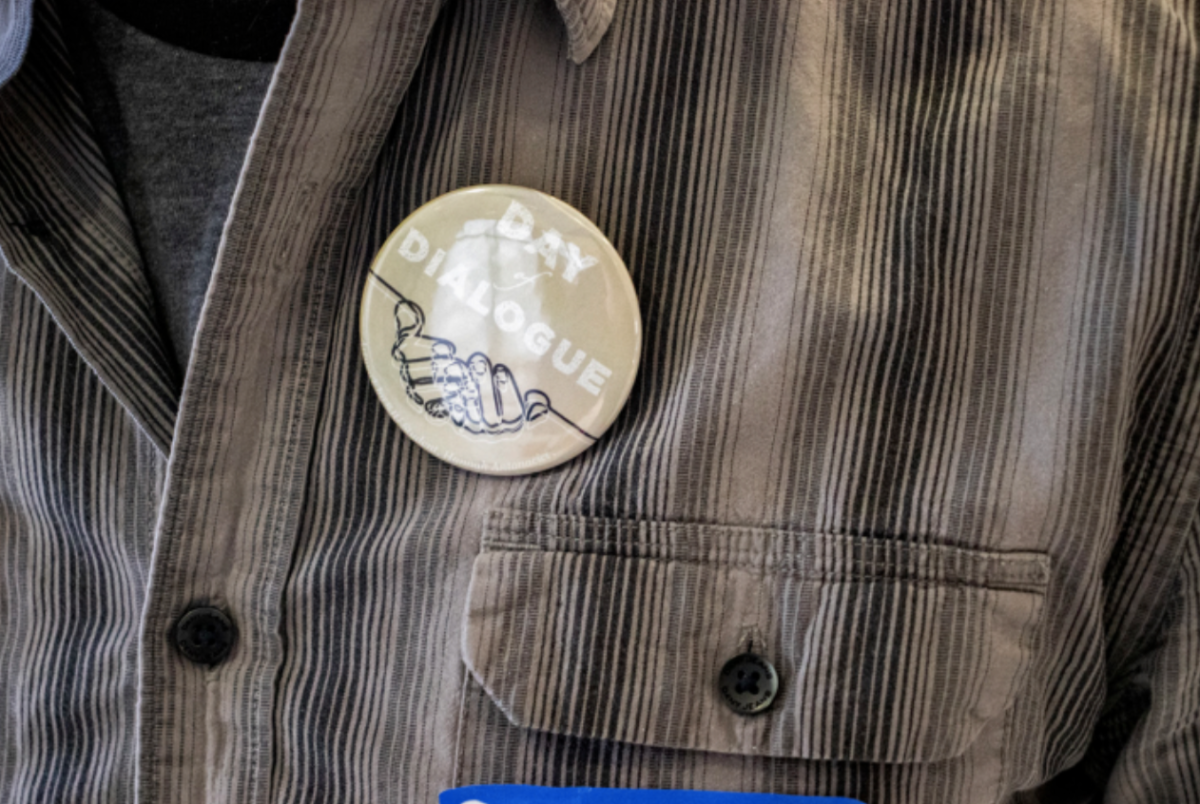 A person wears a pin during the 2021 Day of Dialogue. 
FILE PHOTO: LUKAS VAN SANT ’21/THE HAWK