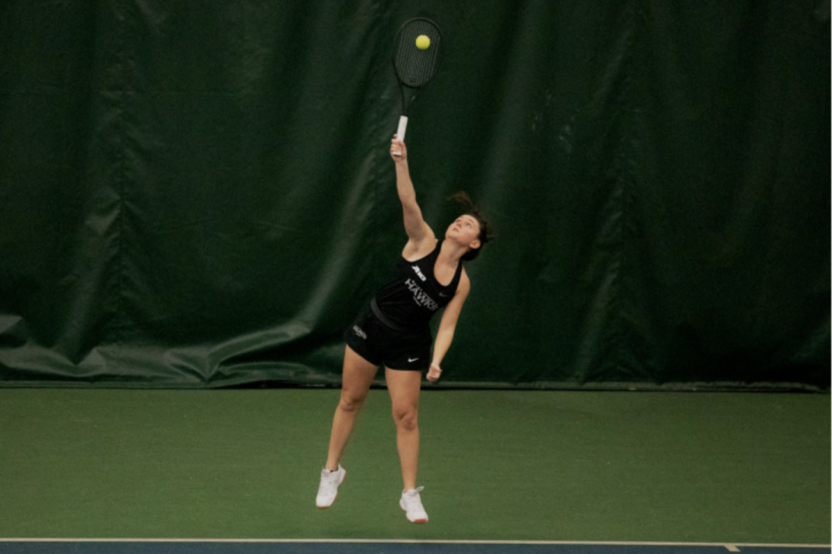 Junior Stow Weiss launches into a serve. Weiss won her singles match by a score of 6-0, 6-0 against Chestnut Hill’s Nele Haag. PHOTOS: KELLY SHANNON 24/THE HAWK