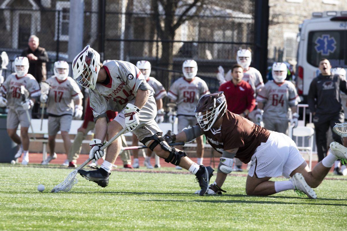 Jack Anderson, a graduate student midfielder, corrals the ground ball. Anderson was the recipient of the team’s Ultimate Warrior Award in 2019. PHOTOS: KELLY SHANNON ’24/THE HAWK