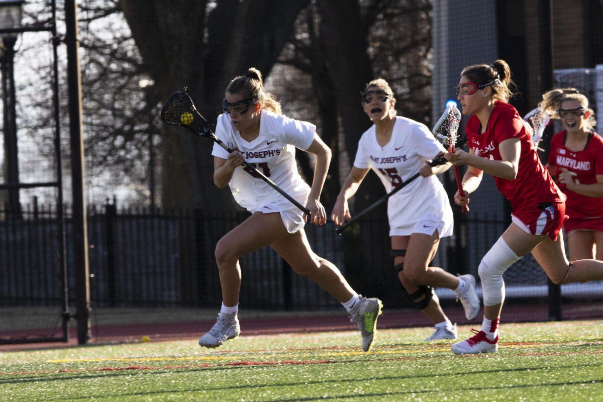The+team+dropped+its+first+game+of+the+season+to+nationally-ranked+University+of+Maryland+on+Feb.+12.+PHOTOS%3A+KELLY+SHANNON+%E2%80%9924%2FTHE+HAWK