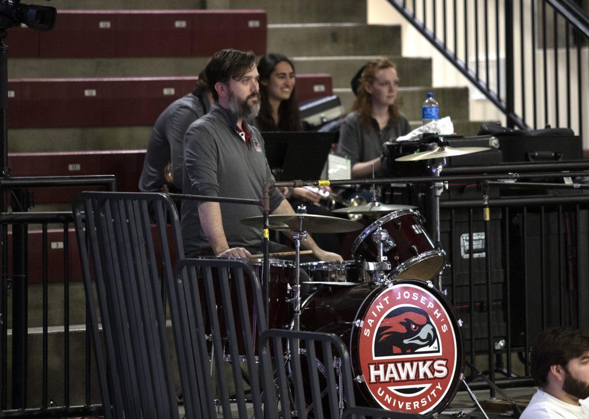 Hemsley plays the drums in place of a student during a home game.
PHOTO: KELLY SHANNON ’24/THE HAWK